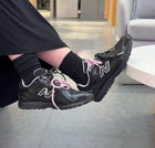 New Balance 2002R – noir vernis