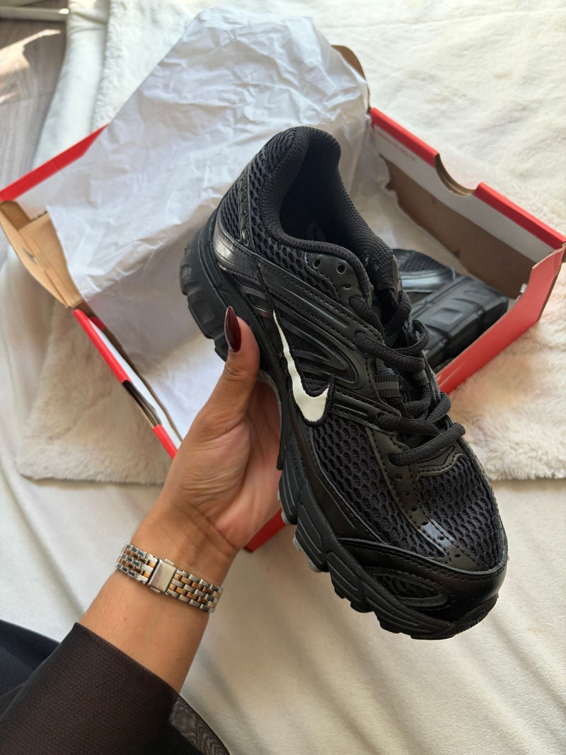Black Nike running in its box